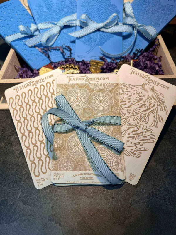 Intricately designed wooden puzzle pieces with a blue ribbon on a patterned background.