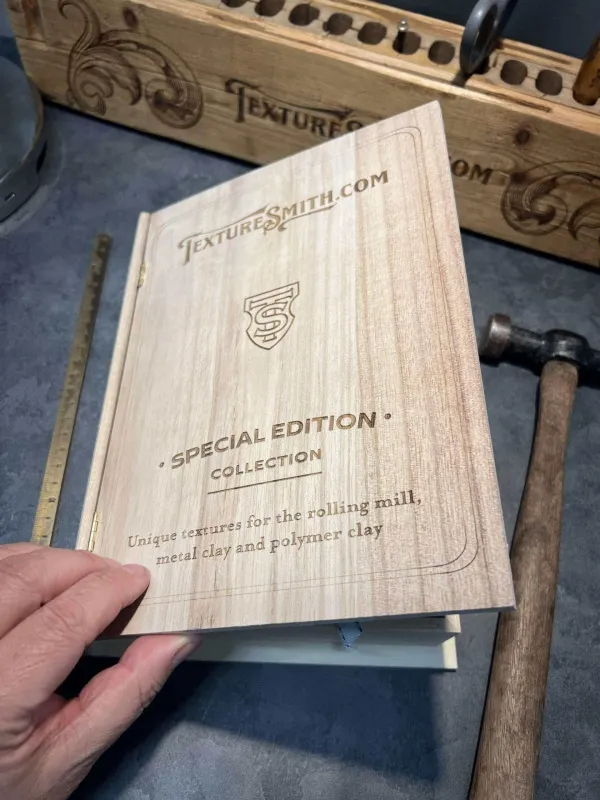 A wooden box engraved with 'Special Edition' and intricate text and design.