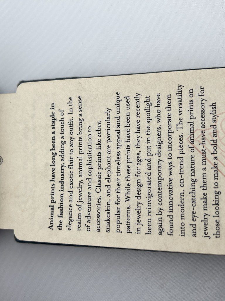 A close-up of a torn book page with printed text about a character named Mrs. Tynan.