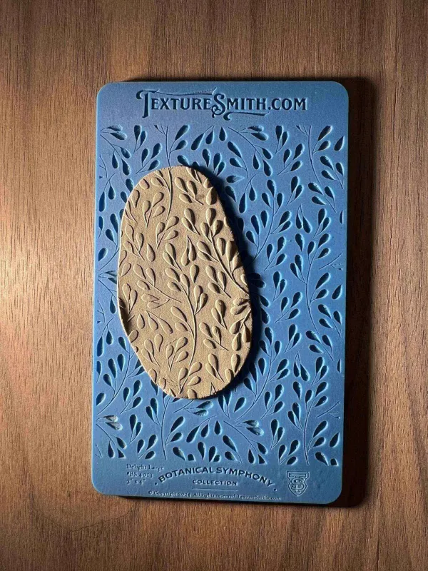 Book cover with textured design and leaf patterns on blue and beige background.