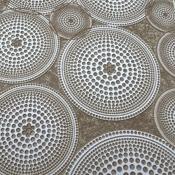 Circular, perforated metal plates arranged in a pattern.