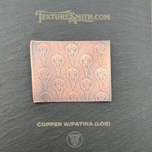 Copper sheet with Wupatinta embossed pattern on a black background.