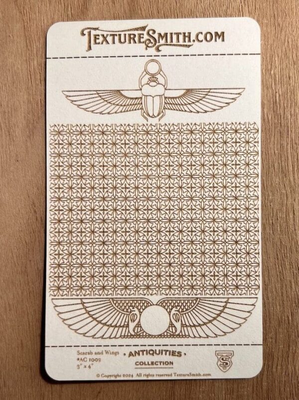 Ancient Egyptian-themed patterned artwork with scarab beetles and hieroglyphic motifs.