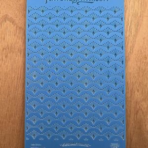 Blue patterned fabric with intricate geometric designs.