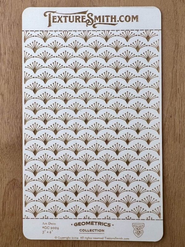 Decorative white paper with gold and brown fan patterns.