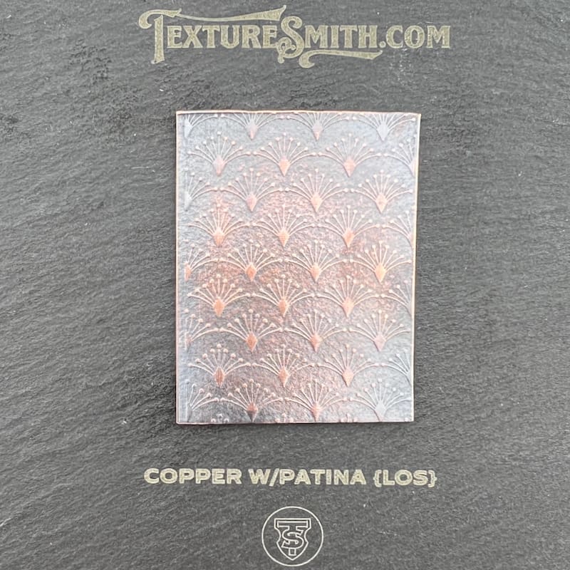 Textured copper panel with patina and gloss finish.