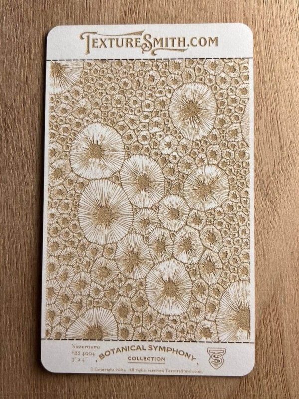 Intricate lace artwork featuring circular floral patterns on a wooden surface.
