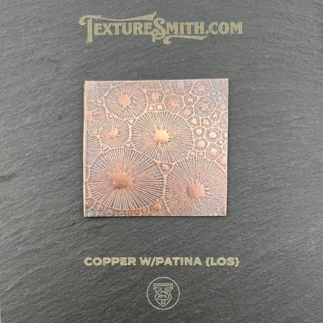 Copper metal sheet with a textured, patina finish.