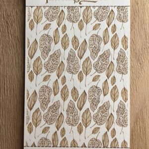 Notebook with a brown leaf pattern on the cover.