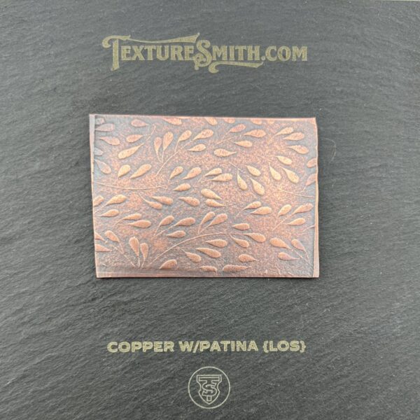 Copper sheet with Wapatina patina finish on a dark background.
