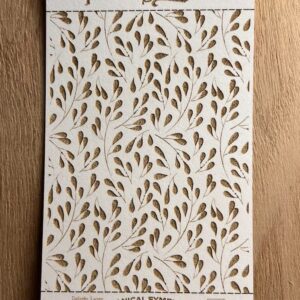 Decorative wallpaper with gold leaf patterns on a white background.
