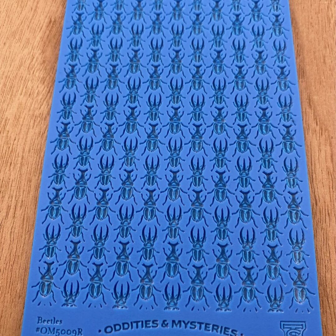 Blue sheet with repeated black spider illustrations.