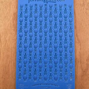 Blue card with rows of small black symbols resembling arrows.