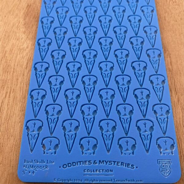 Blue card with repeated question mark designs and text at the bottom.
