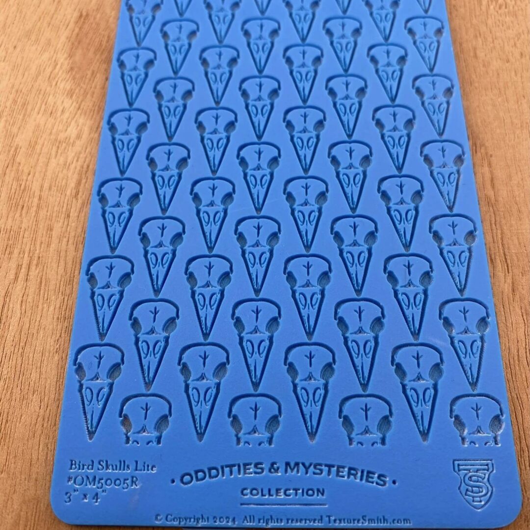 Blue card with repeated question mark designs and text at the bottom.