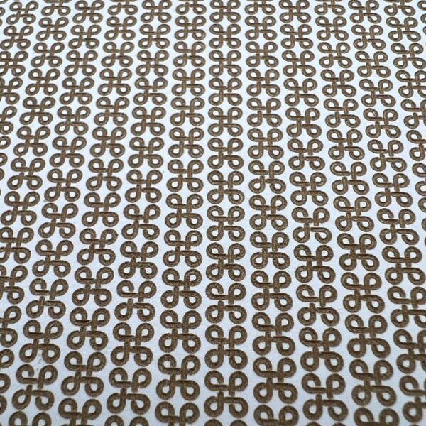 Pattern of brown and white geometric shapes forming a repeating design.