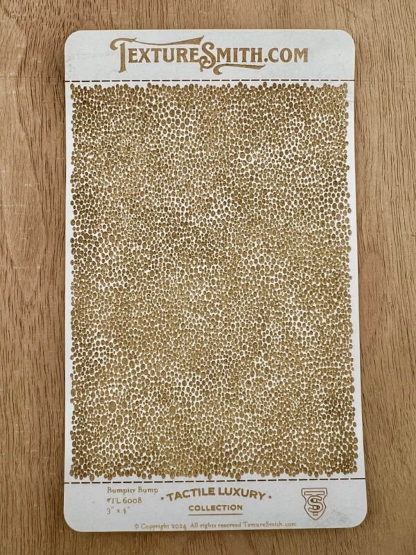 Rectangular beige and white textured rug on wooden floor.