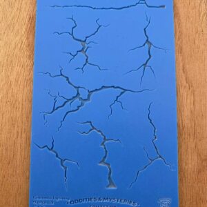 Blue surface with multiple black crack-like patterns.