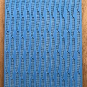 Blue textured fabric sample with woven patterns.