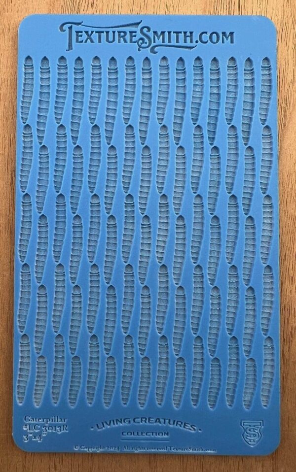 Blue textured fabric sample with woven patterns.