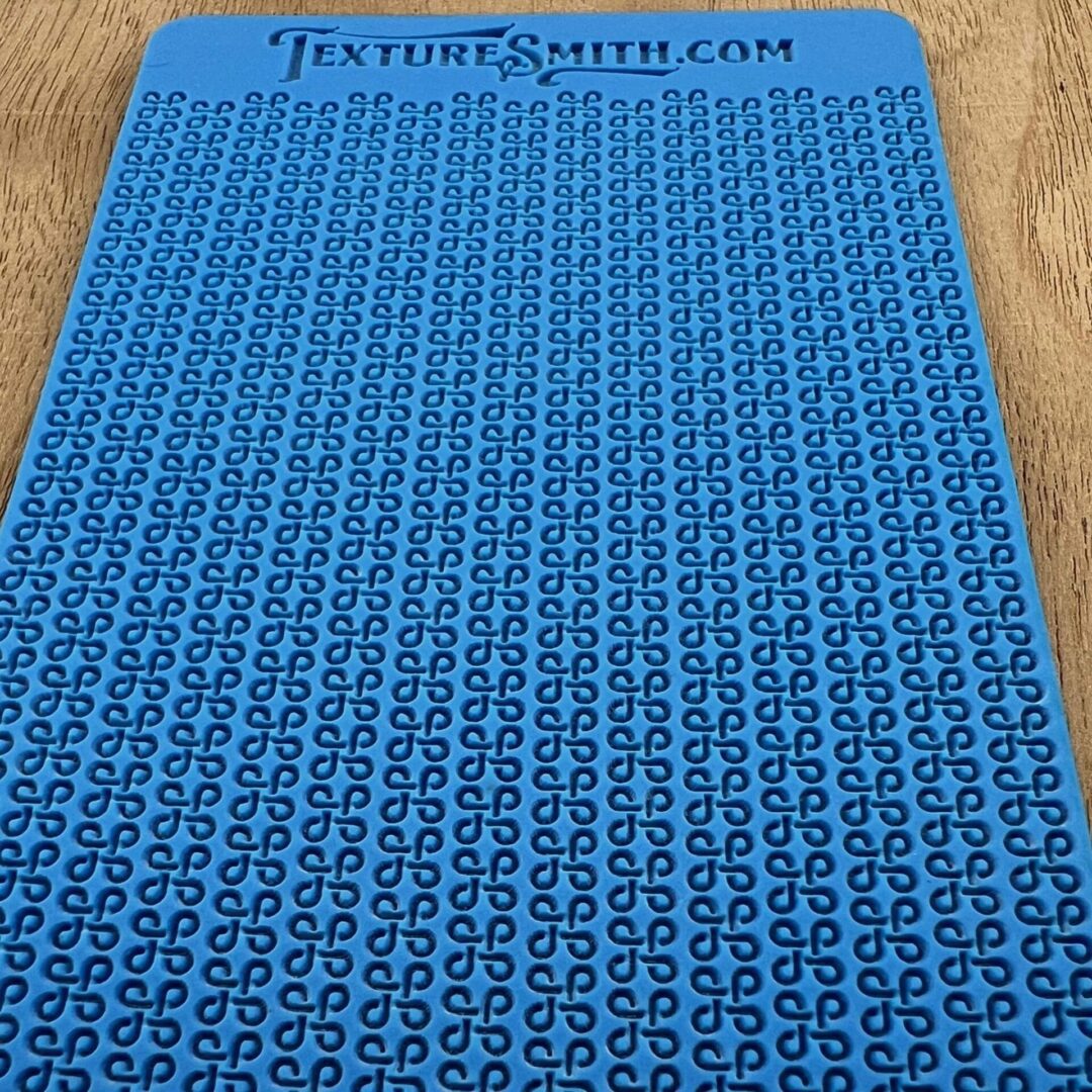 Blue sheet covered with a grid of black symbols and characters.
