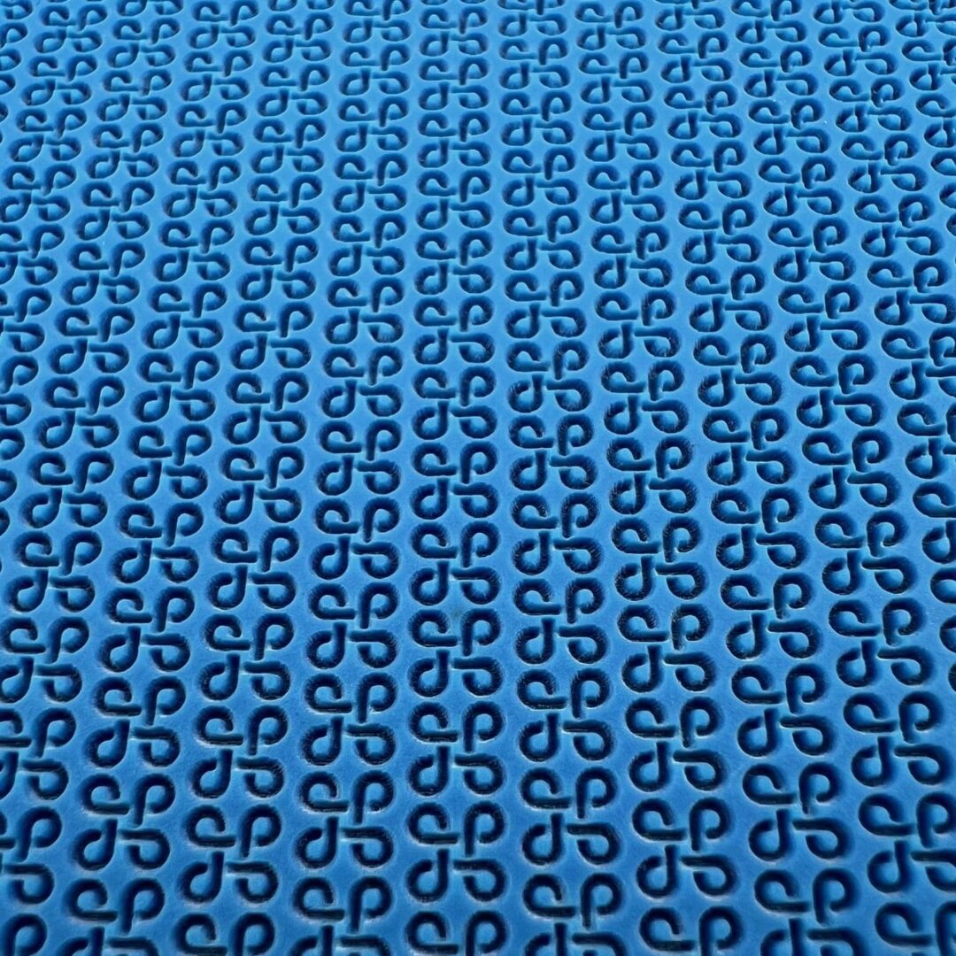 Blue fabric with a repeating dollar sign pattern.
