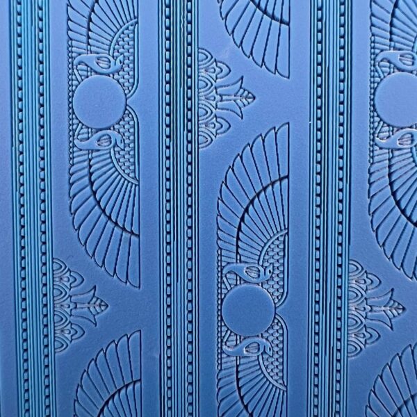 Blue wall with Egyptian-inspired winged sun and lotus motifs.