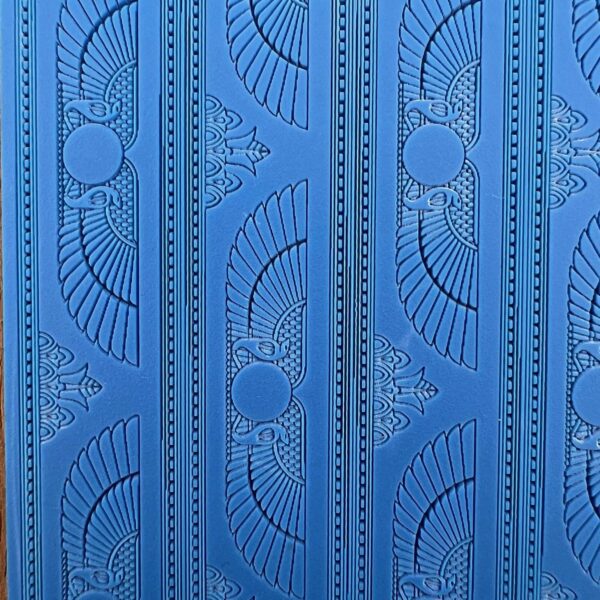 Intricate blue wall panel with geometric and circular patterns.