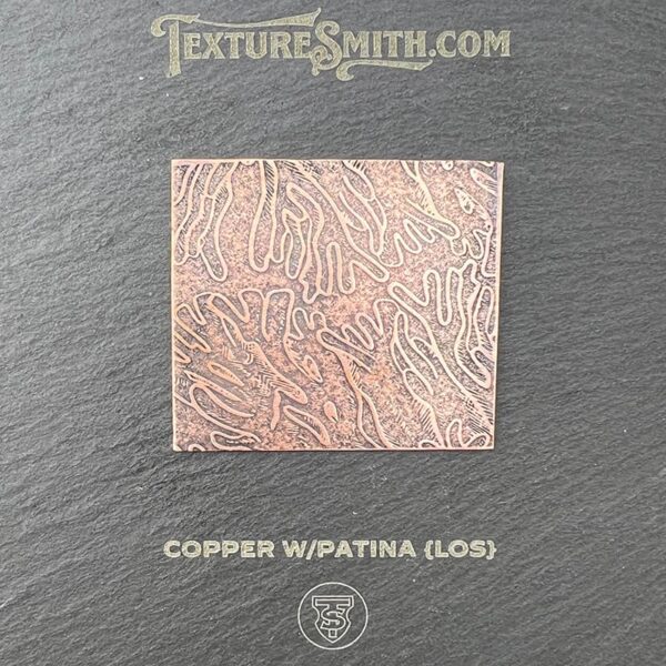 Copper square with a patina finish showing intricate textures.