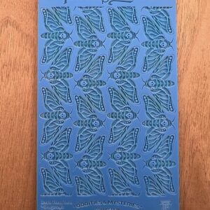 Blue stencil sheet with leaf patterns arranged in rows.