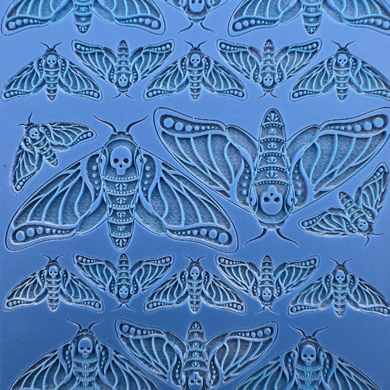 Intricately detailed blue bat motifs with ornate patterns.