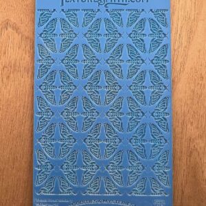 Blue book cover with intricate geometric patterns and text.