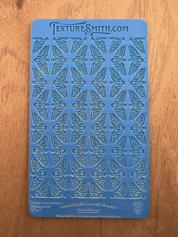 Blue book cover with intricate geometric patterns and text.