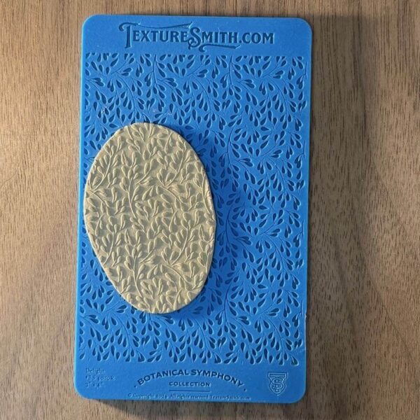 Blue book titled 'Entrepreneurship' with a textured yellow oval on the cover.