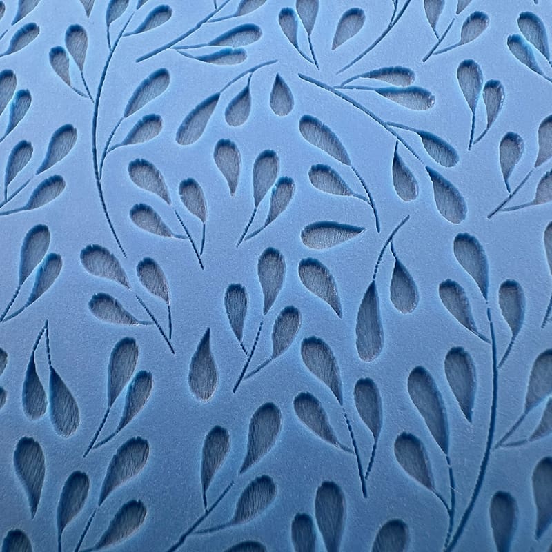 Blue abstract pattern with teardrop shapes and flowing design.