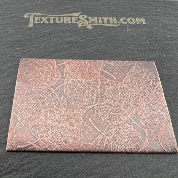 Leather swatch with a textured, cracked pattern in a brown shade.