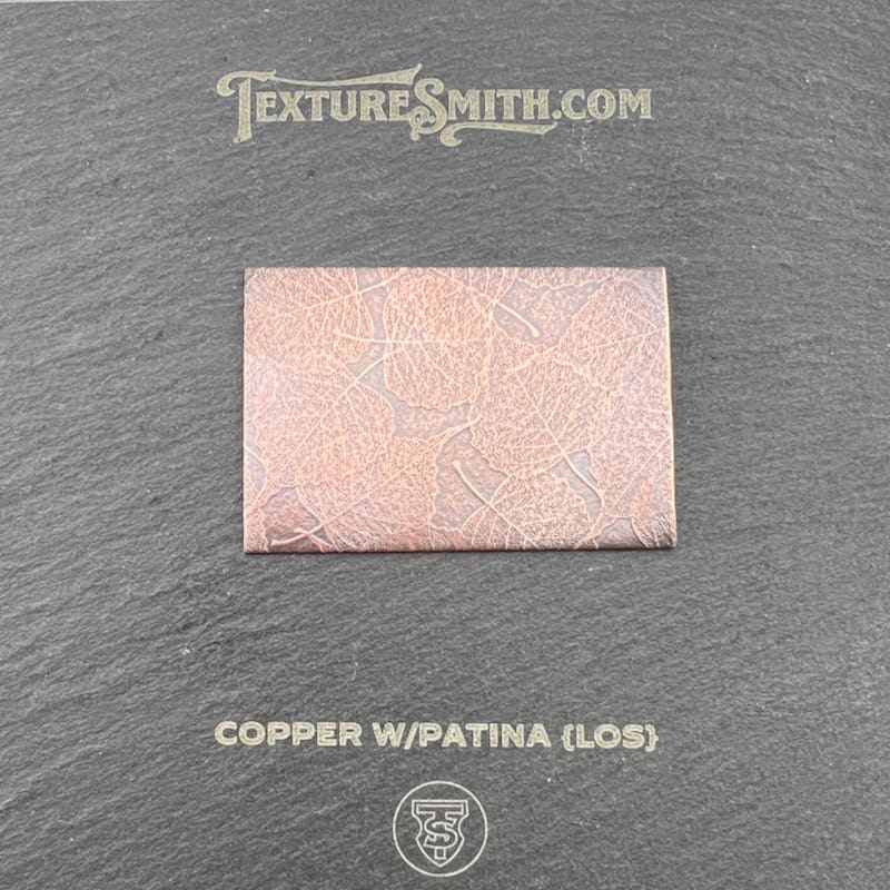 Pink copper patina with a glossy finish on a rectangular metal sheet.