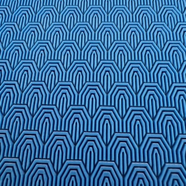 Blue fabric with a geometric pattern of concentric arches.