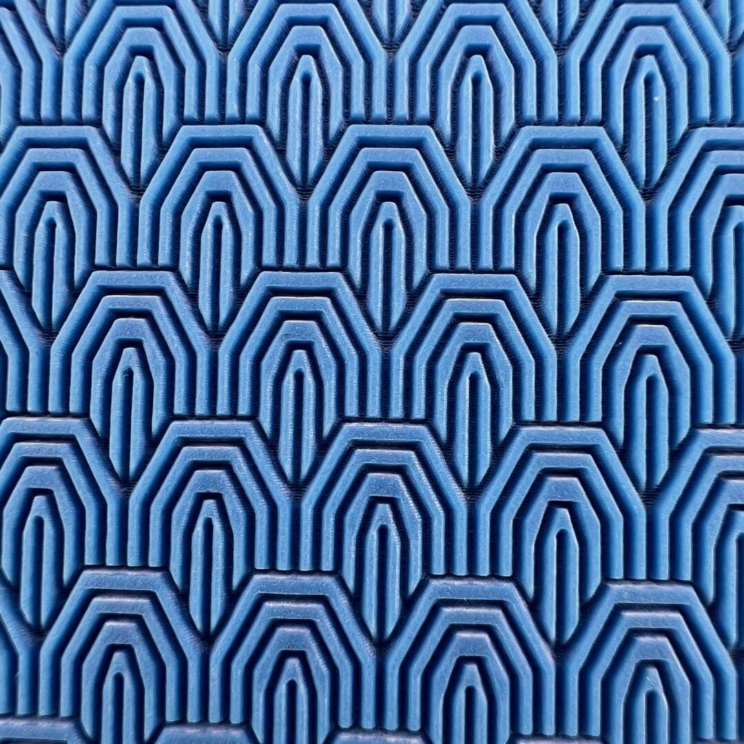 Blue geometric pattern with interconnected shapes.