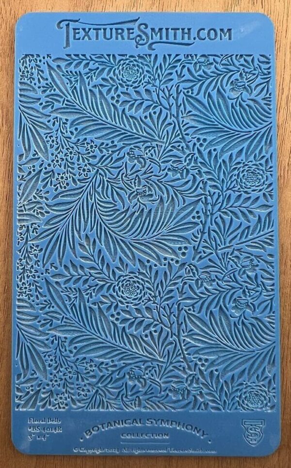 Blue artwork with intricate leaf patterns.