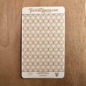 A card displaying a geometric pattern of interlocking circles on wood.