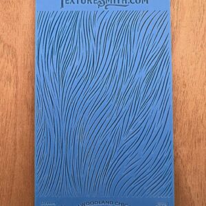 Blue textured book cover with wavy line patterns.