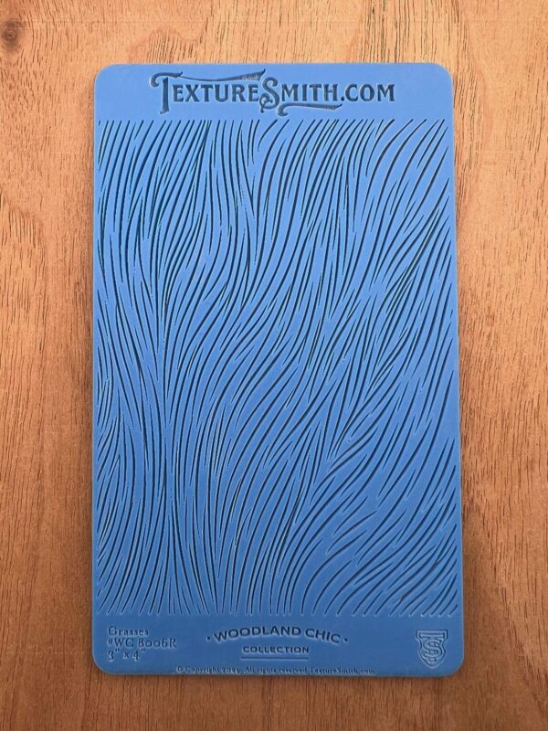 Blue textured book cover with wavy line patterns.