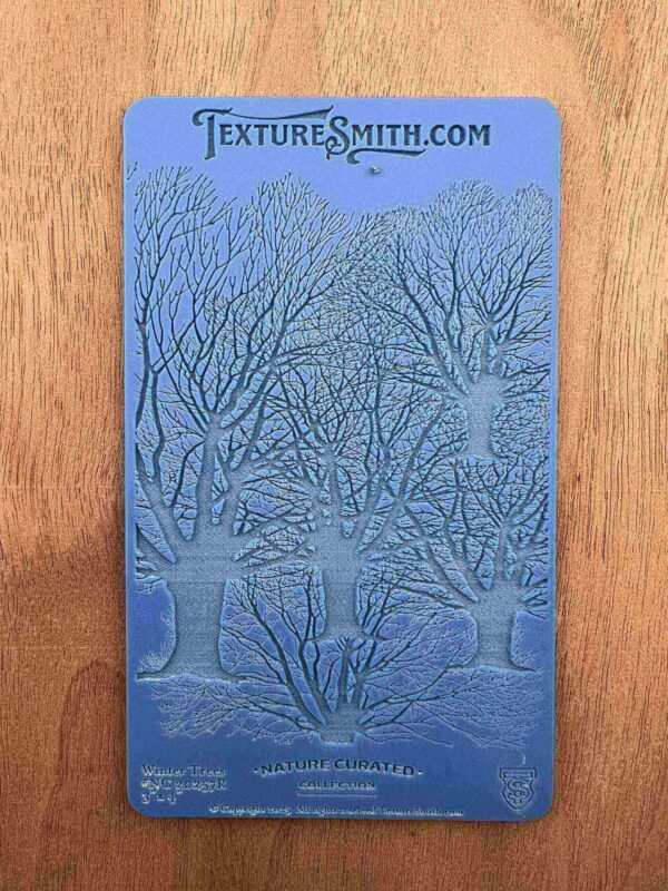 Blue texture plate with intricate coral and seaweed designs.