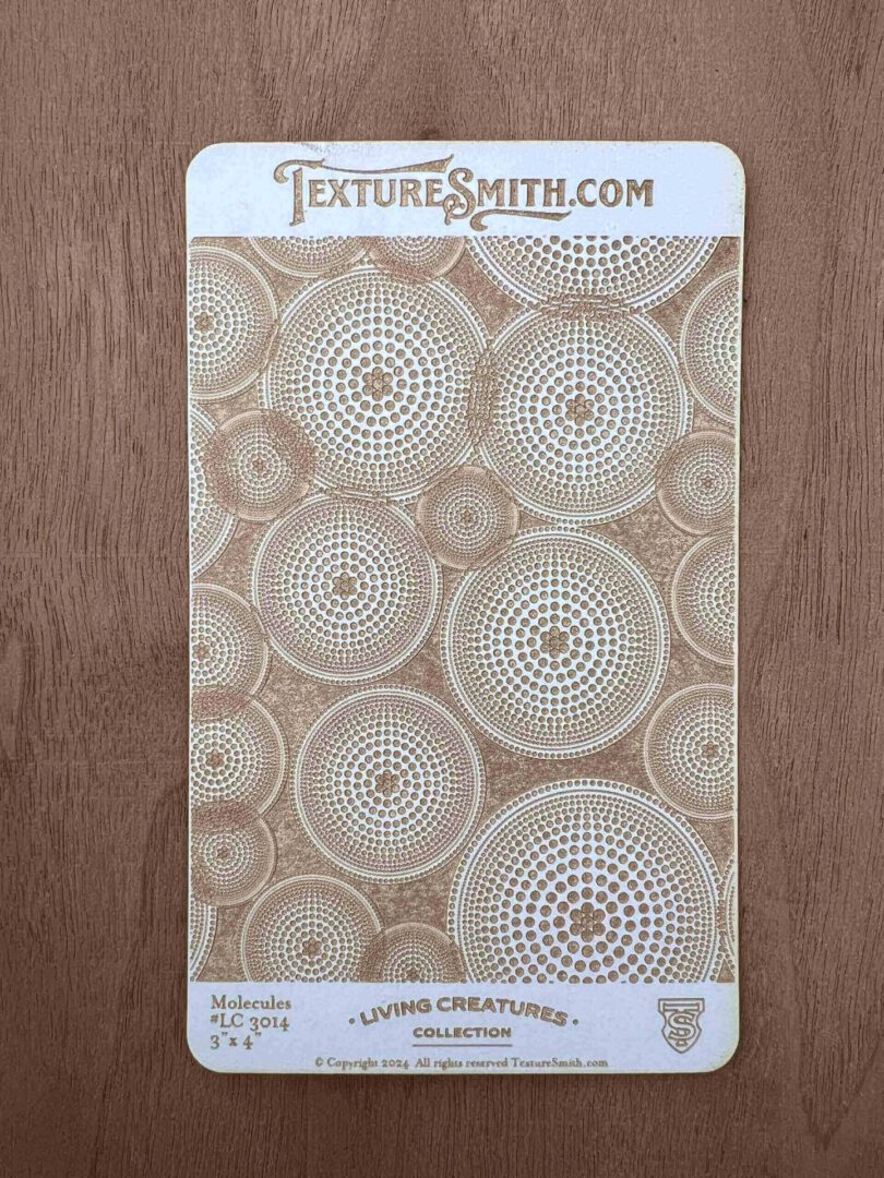 A beige textured wallpaper with circular, lace-like patterns.