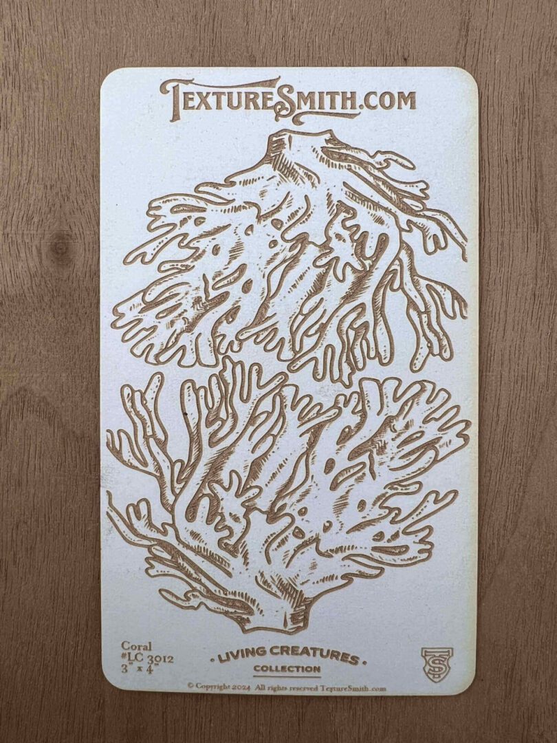 Intricate wooden coral cutouts on a wooden background.