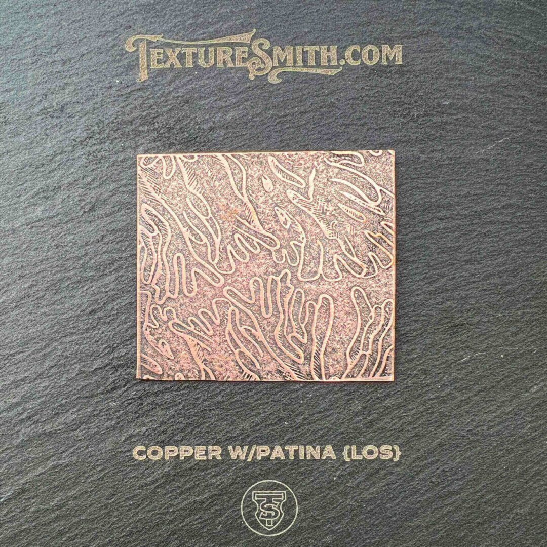 Glossy copper swpatina texture with intricate patterns.