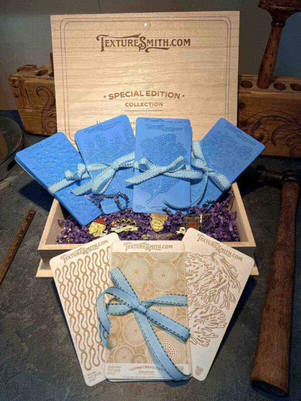 Elegant gift boxes with blue ribbons and intricate designs.