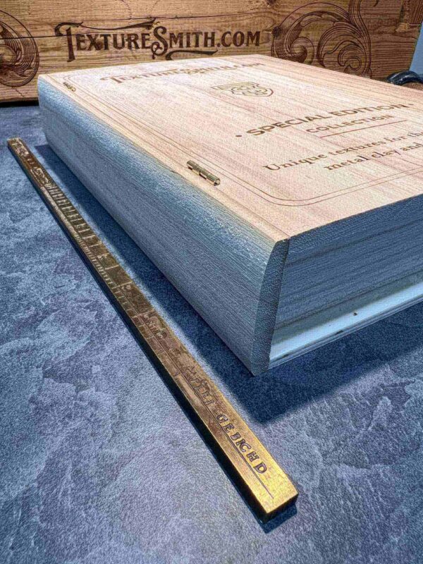 Thick book with a ruler beside it for size comparison.