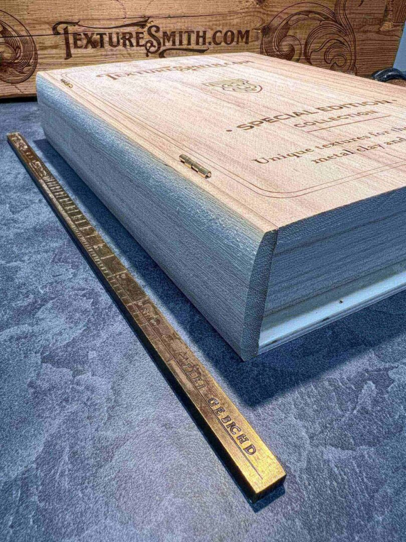Thick book with a ruler beside it for size comparison.
